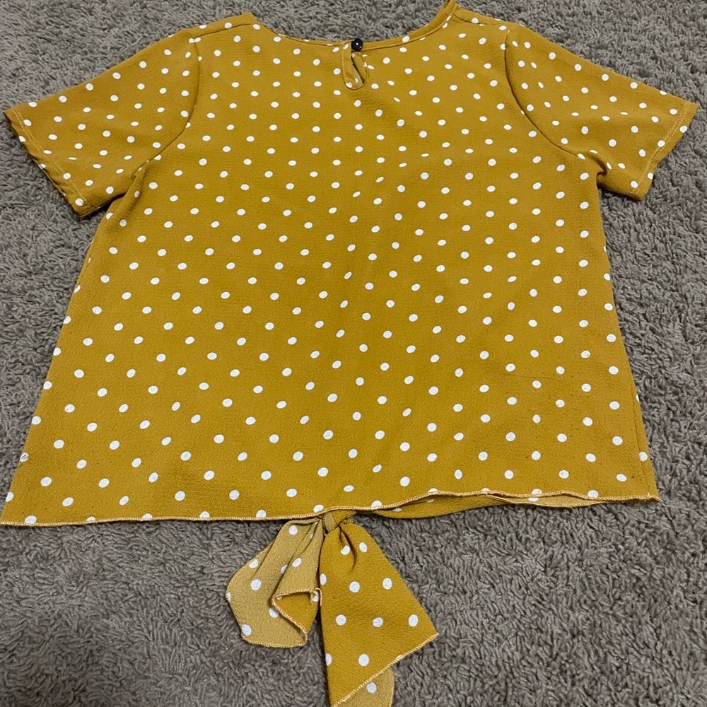 A yellow doted shirt